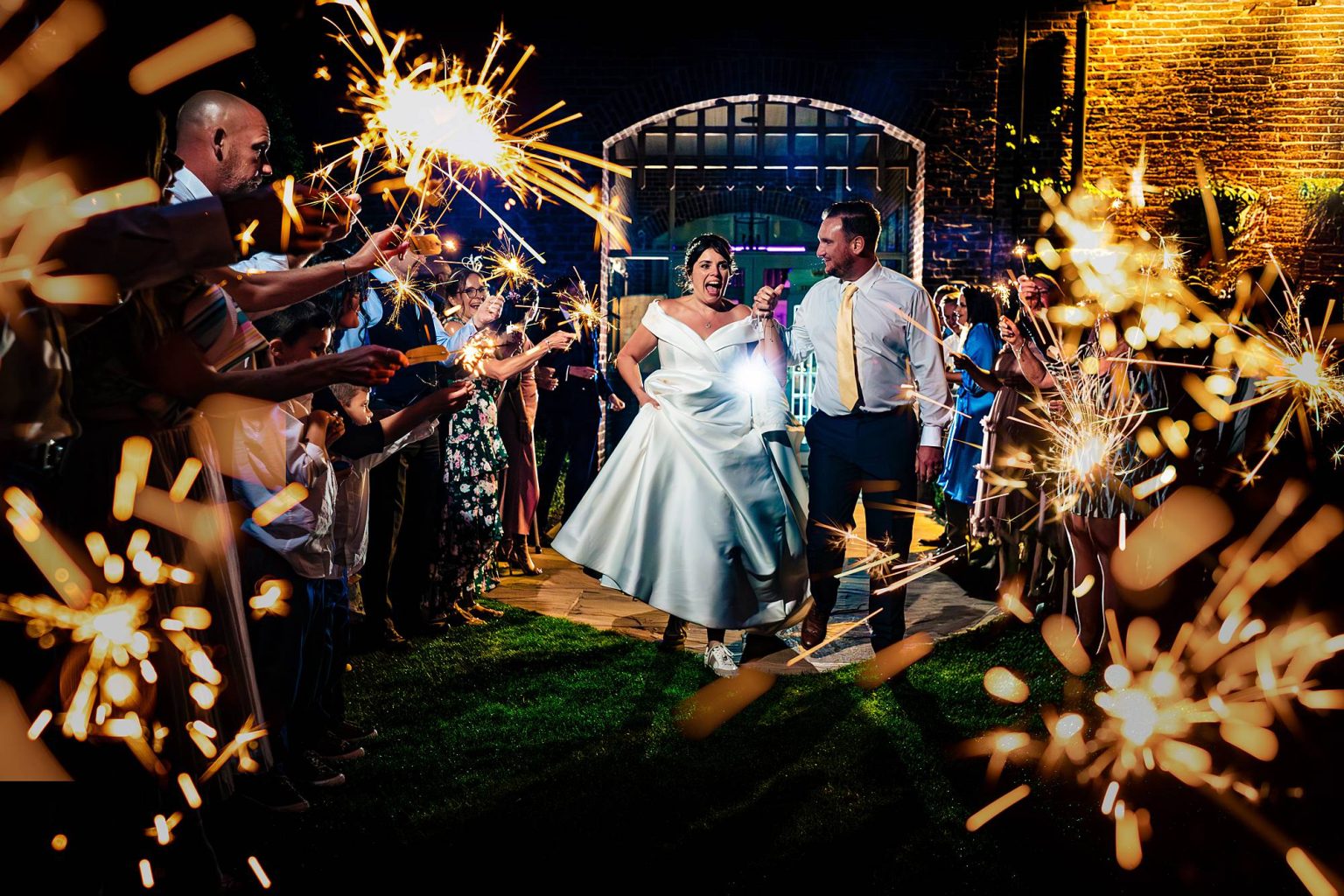 Candid wedding photography – sparkler exit moment