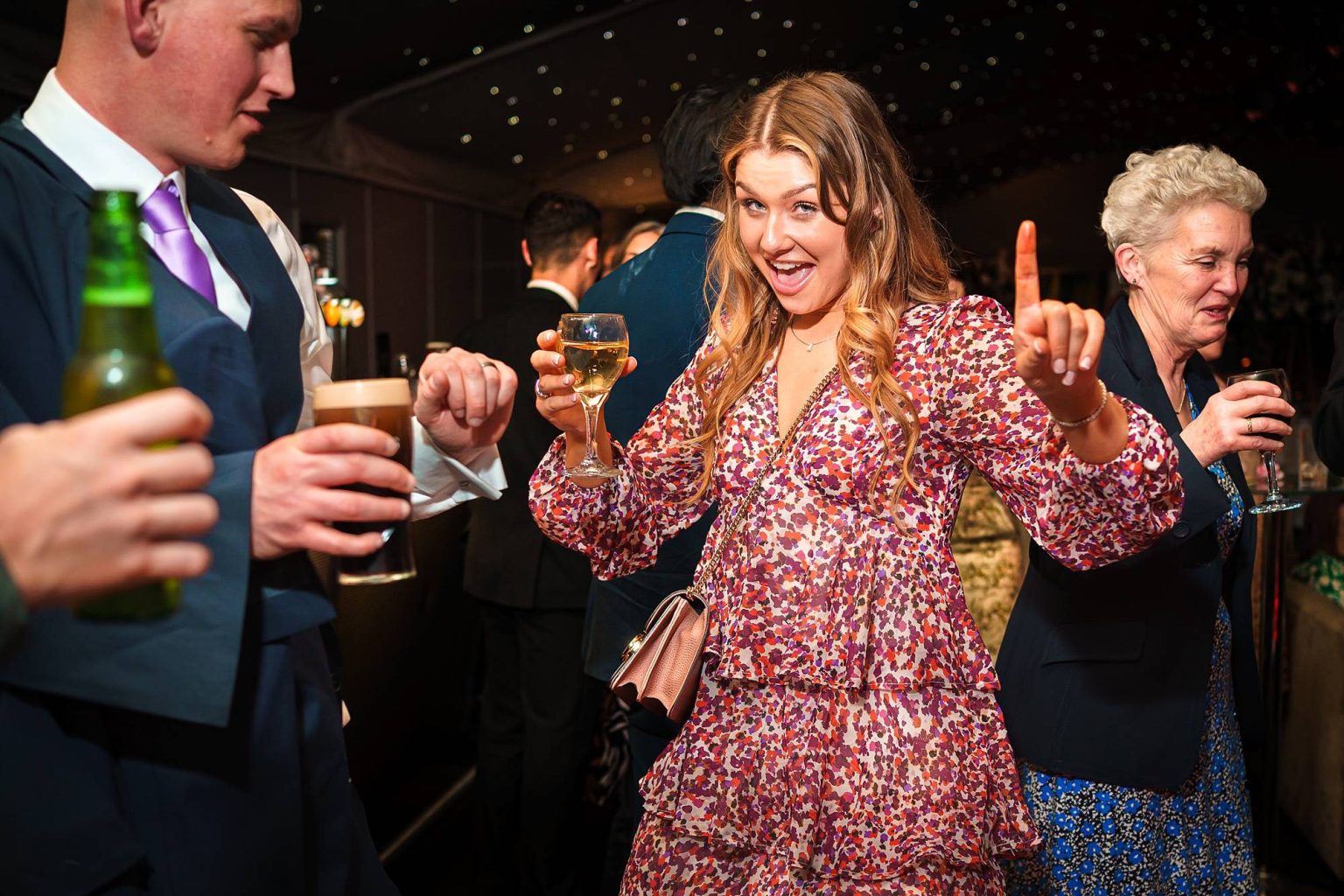 Guests Interacting - Real moments from the dance floor by documentary wedding photographer Emma Staley in Portsmouth